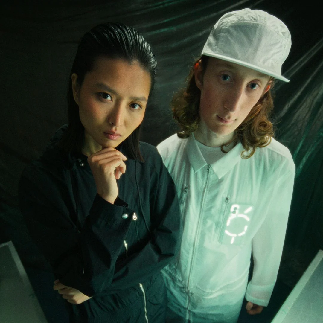 A Nothing Apparel promotional image, featuring overall (L), labcoat and cap (R)