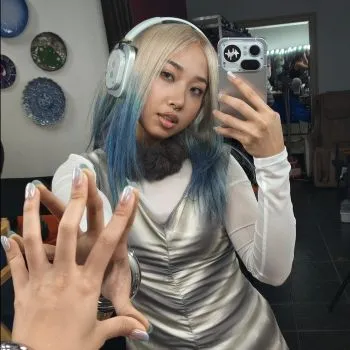 Milli with Headphone (1) and Phone (4a) Pro. Source: [[https://www.instagram.com/p/DXb4iraiOHj|Nothing via Instagram]]
